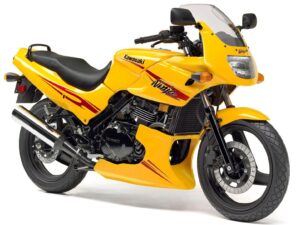 a yellow motorcycle with a windshield
